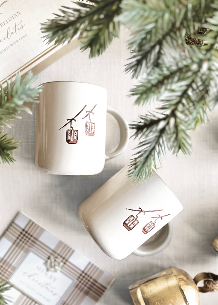 Set Of Two Cream Ski Mugs.